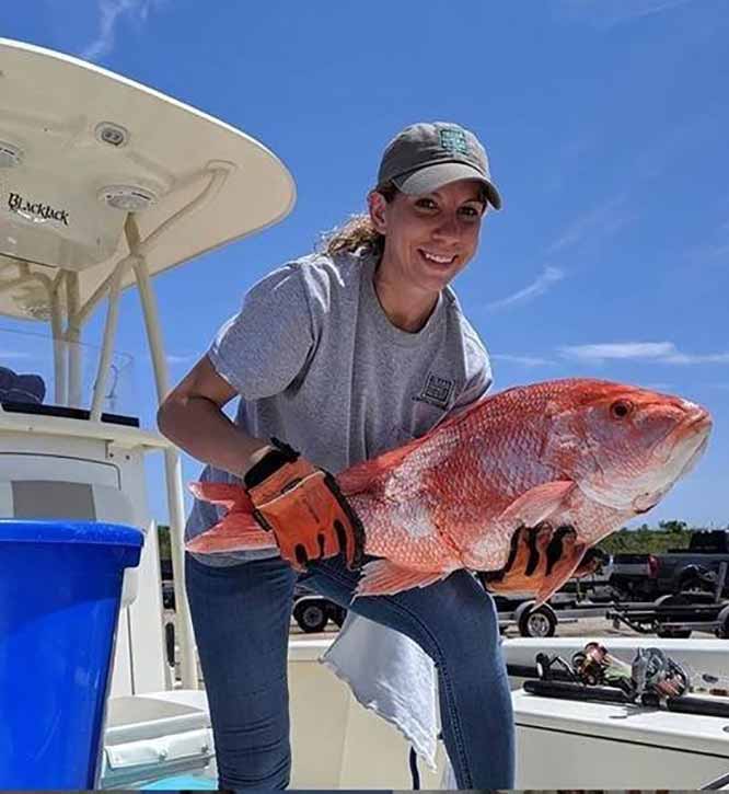 Intern with fish.